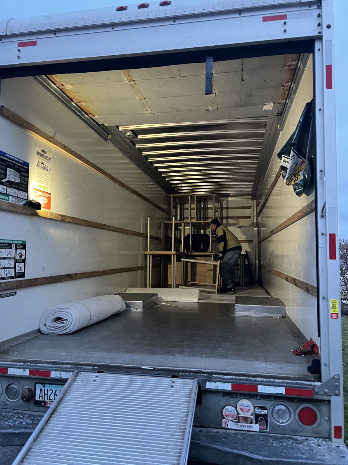 Moving truck loaded with office furniture, filing cabinets and equipment